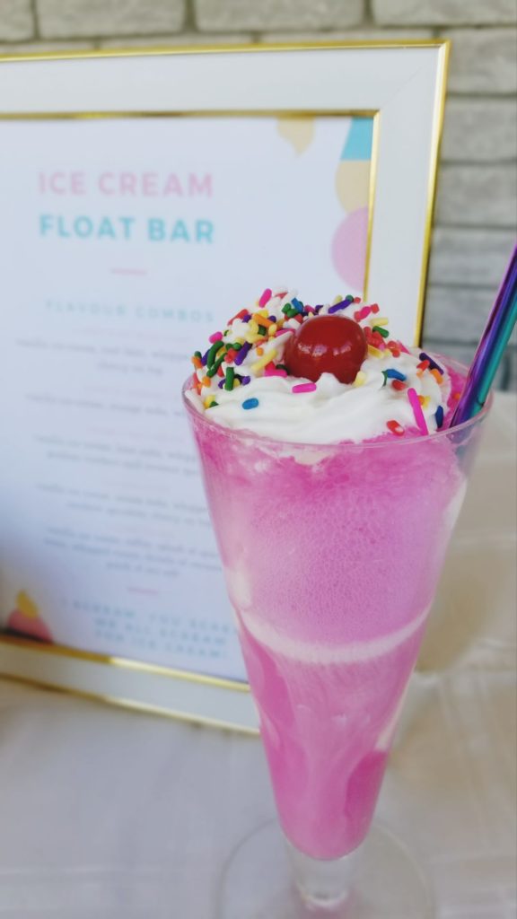 pink ice cream float with sprinkles